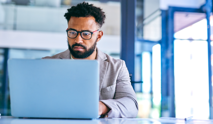 Man typing on laptop
