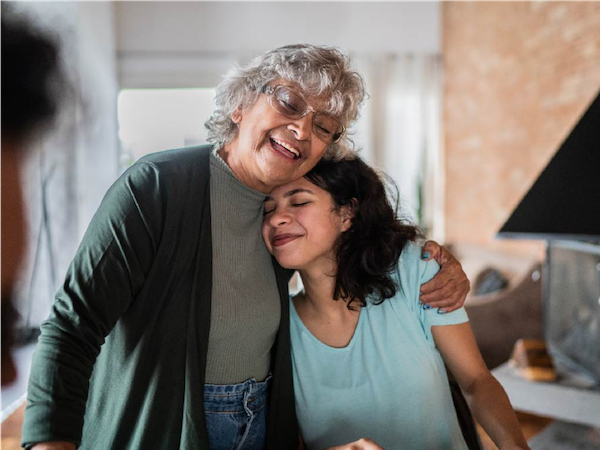 grandma and granddaughter hugging